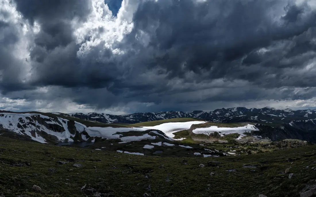Storm clouds over a mountain landscape